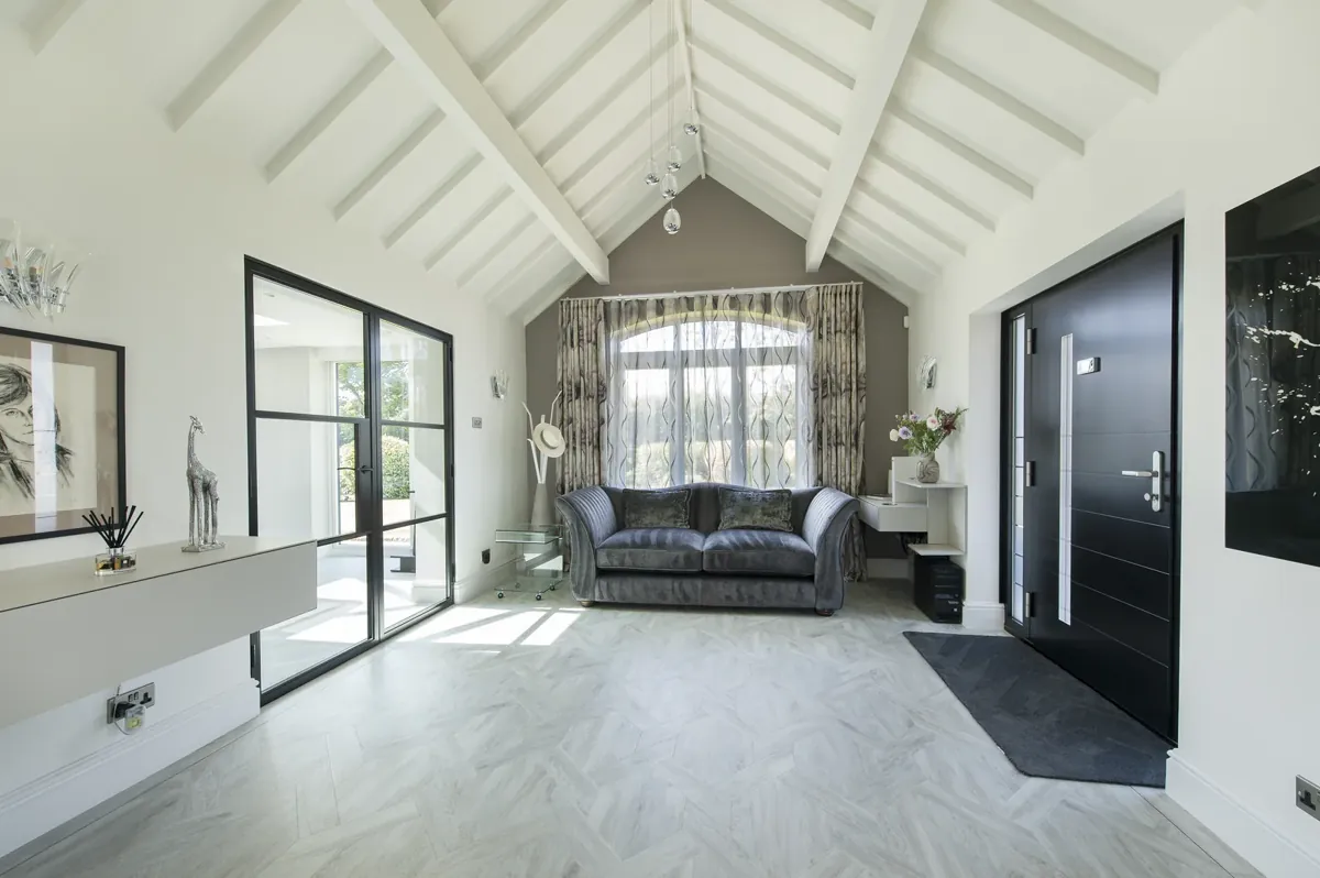 An internal steel-look screen and doors off a lounge
