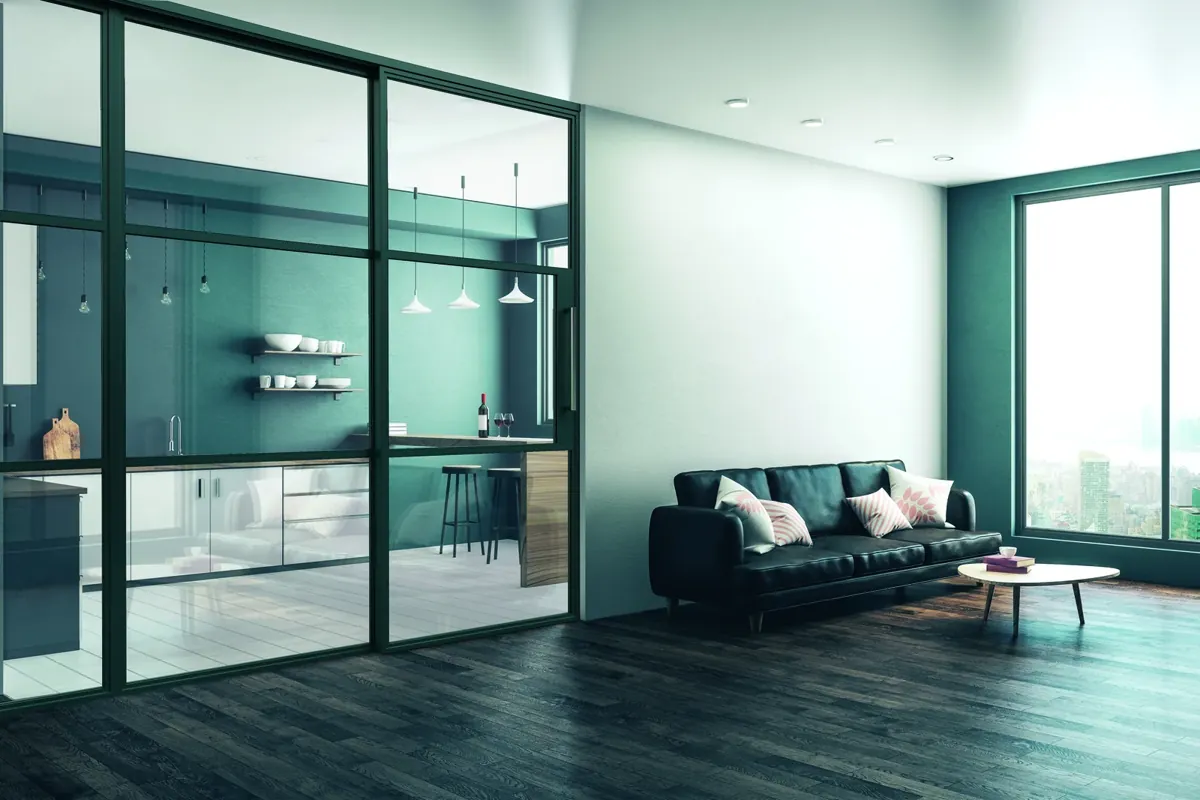 A black-framed sliding screen between kitchen and living room