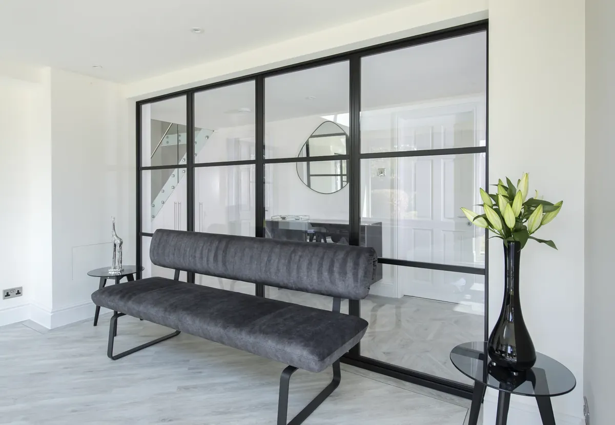 A steel-look screen enclosing a staircase