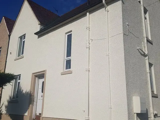A facade coating applied to render