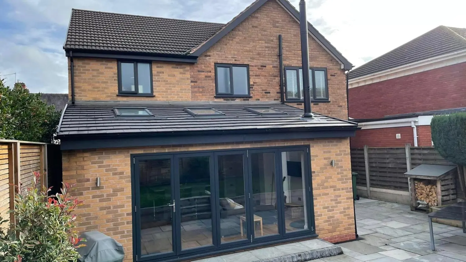 A Merseyside house with new bifold doors, roof and patio by Acorn Home