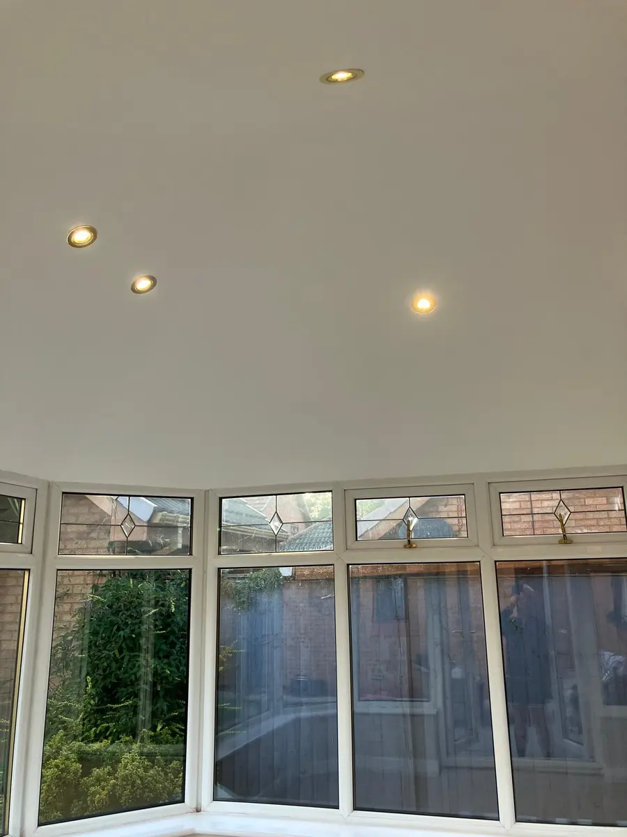 The finished vaulted ceiling with recessed downlights