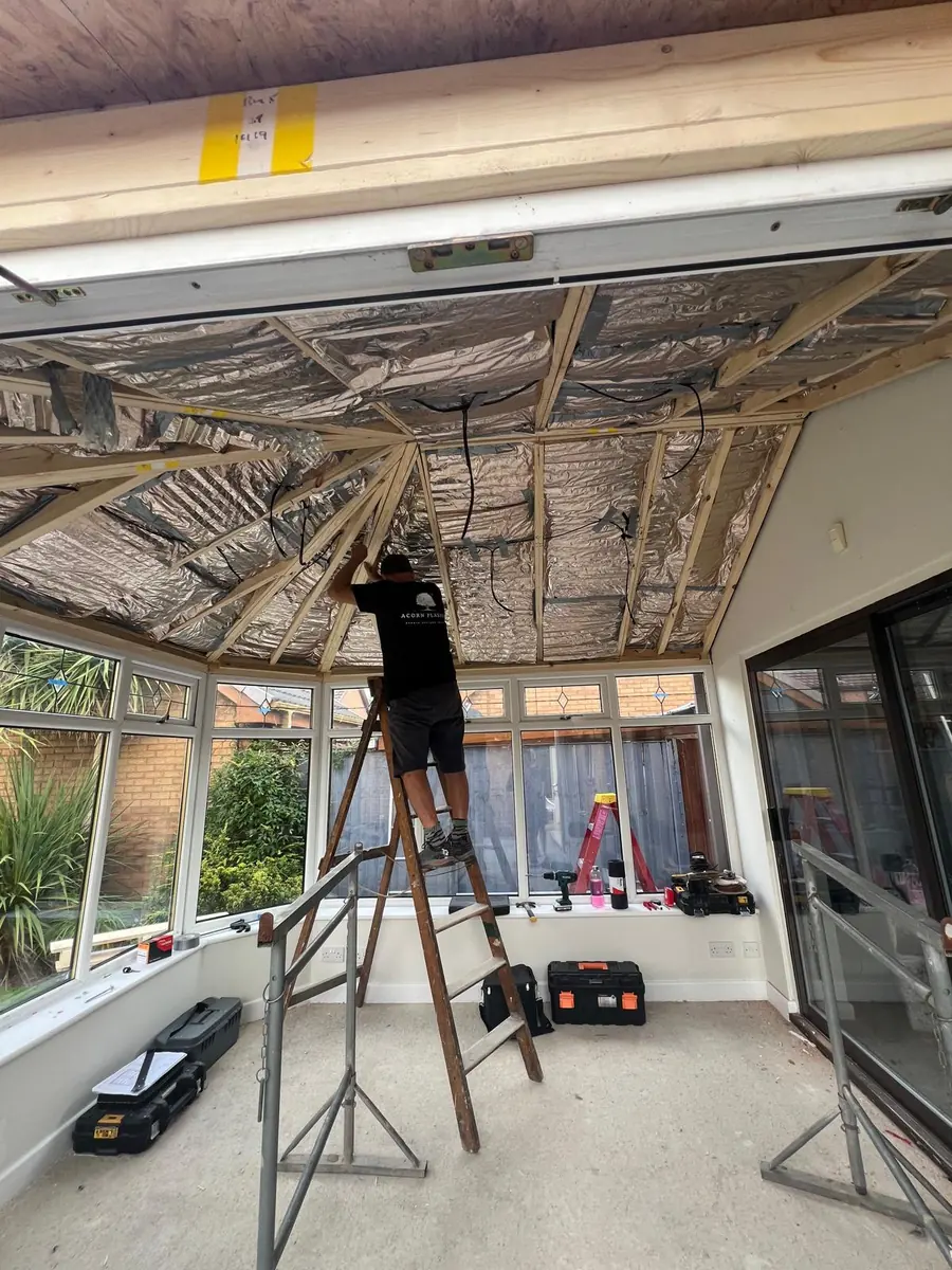 Insulation being fitted inside the new conservatory roof