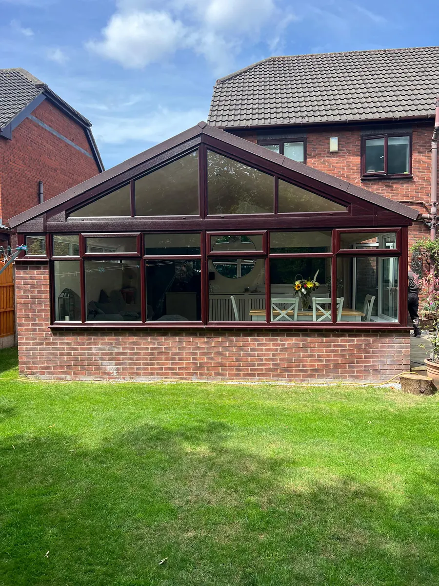 The finished conservatory with its new gable and lightweight tiled roof