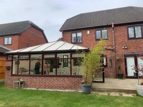 The conservatory before the work, with its original polycarbonate roof