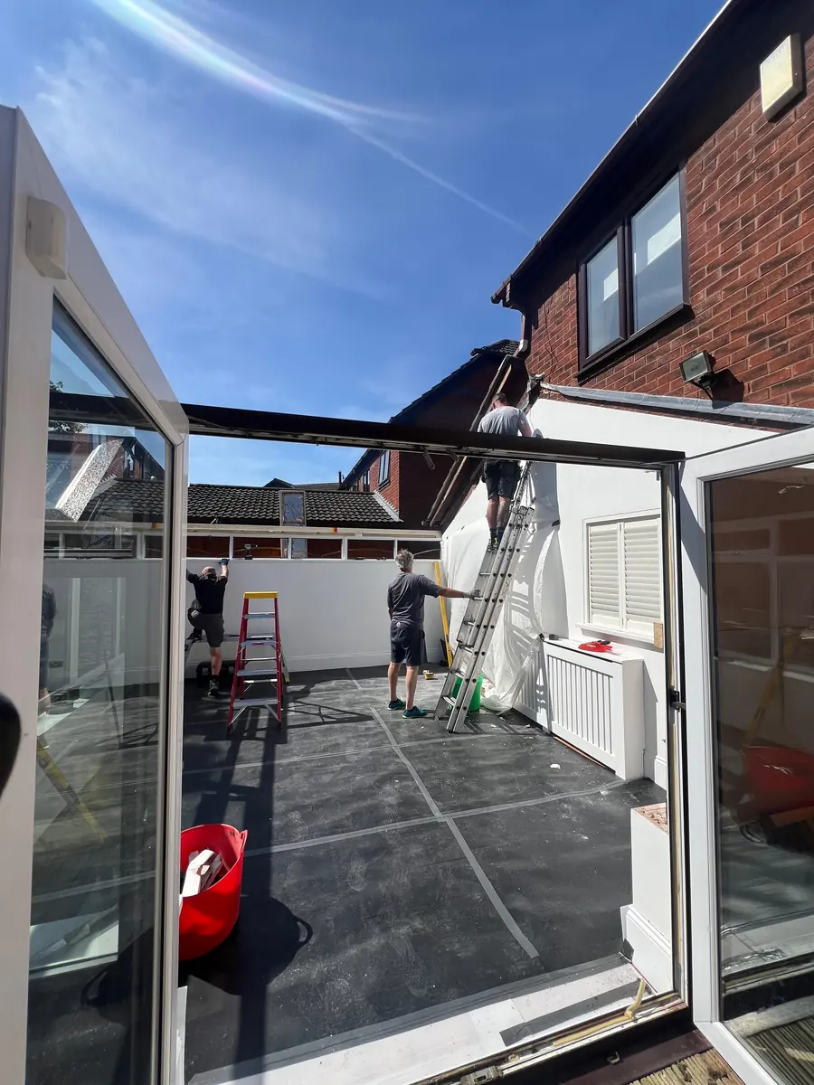 The conservatory open to the sky with the old roof removed