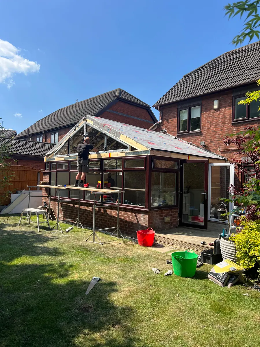 The old conservatory roof being stripped off