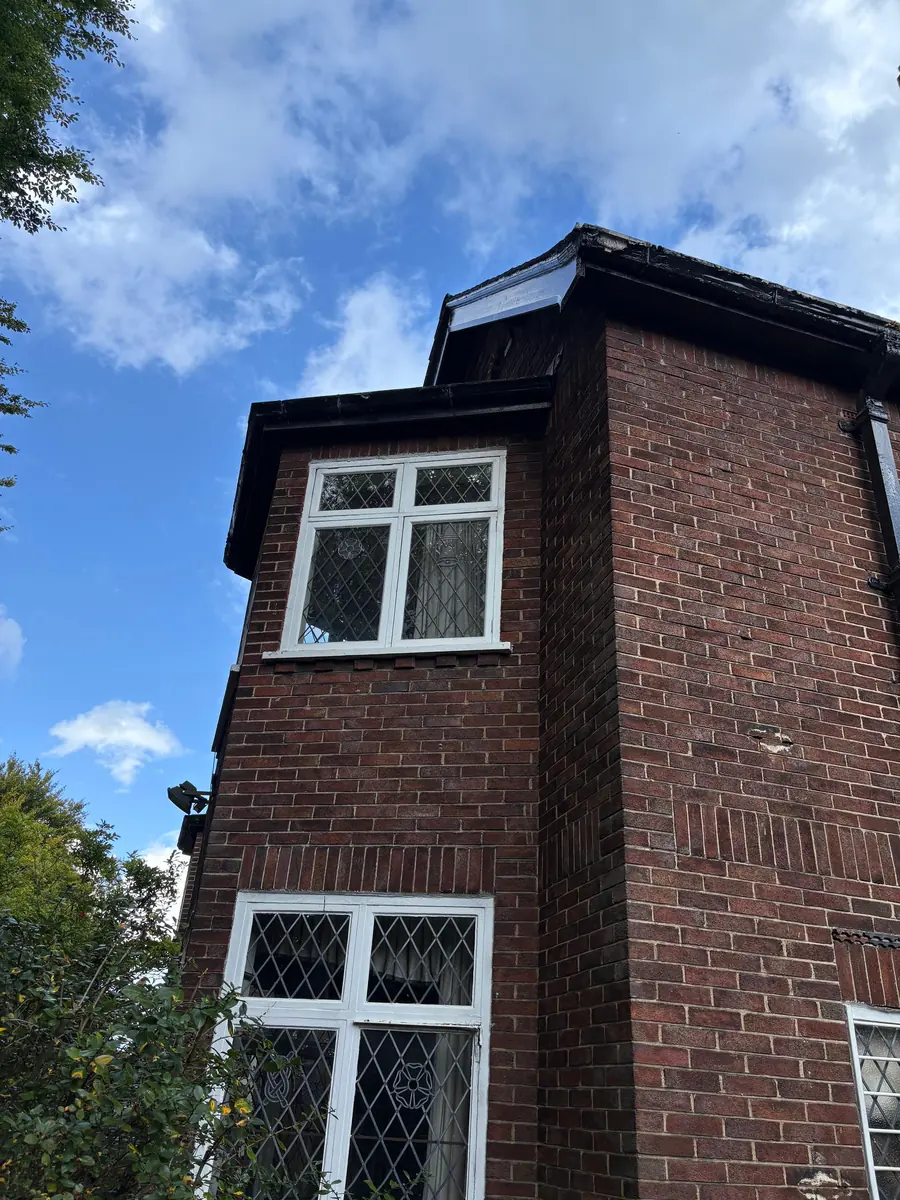 The restored gable and brickwork seen from below