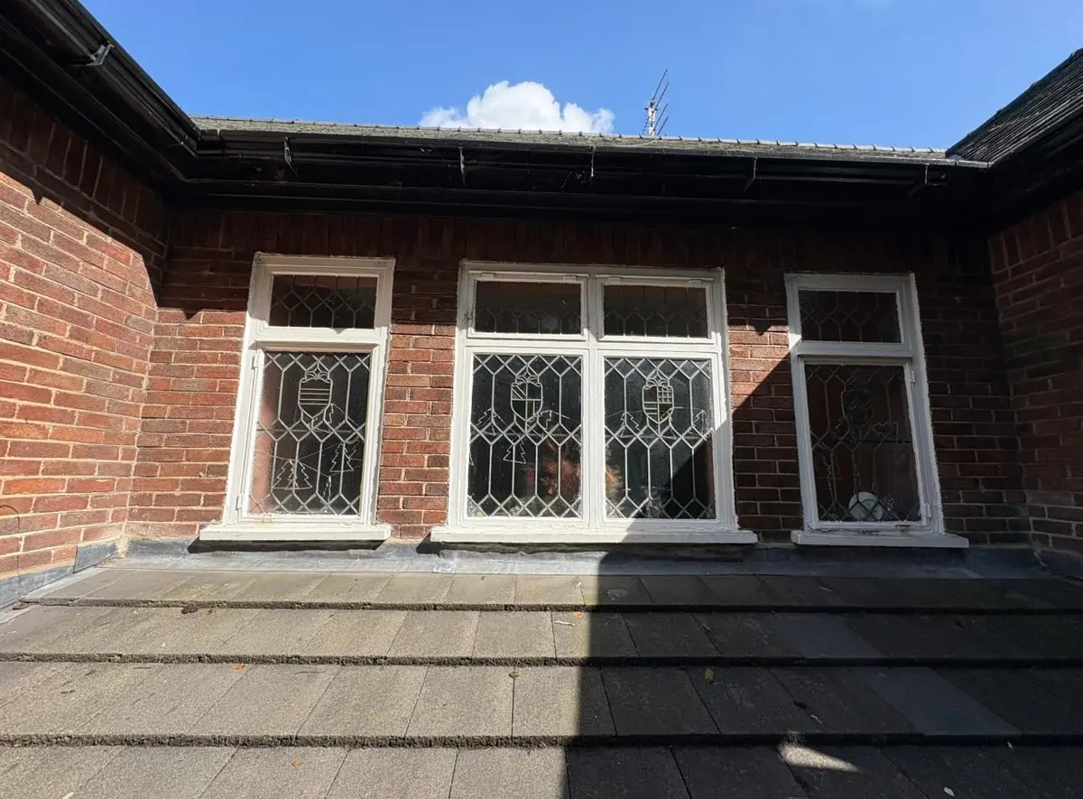 Restored leaded light windows and painted frames