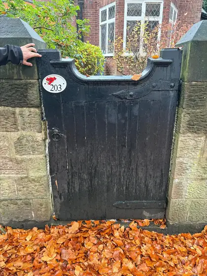 The original gate, rotted and split, before replacement