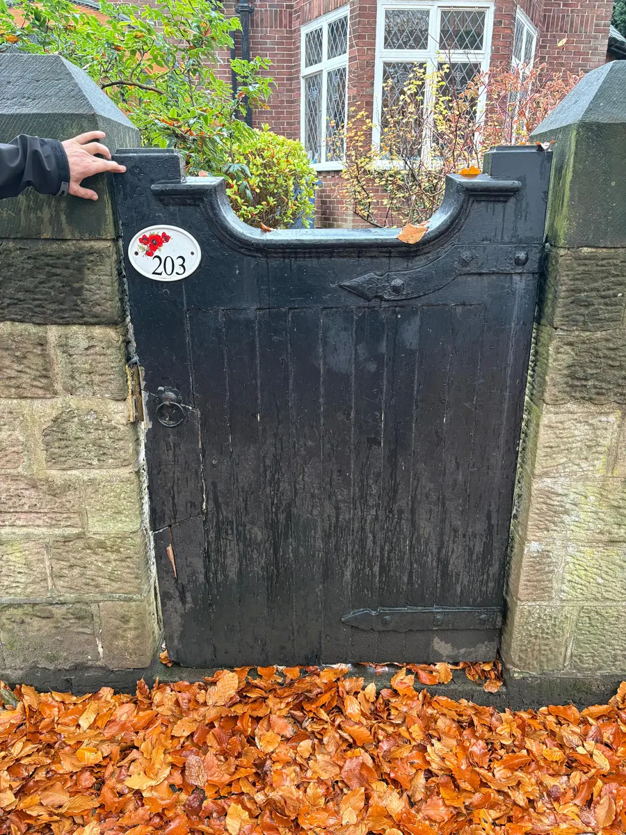 The original gate, rotted and split, before replacement