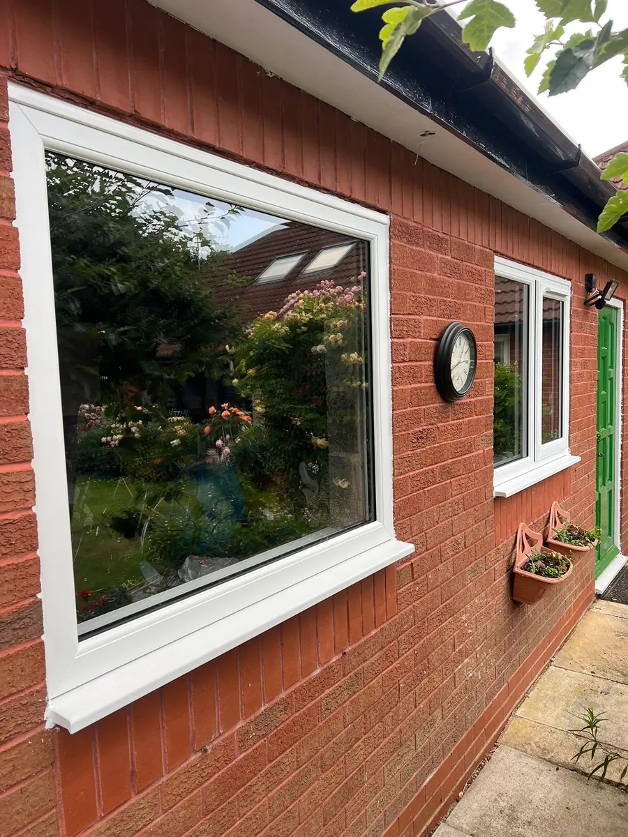The existing white frames on the elevation before the work