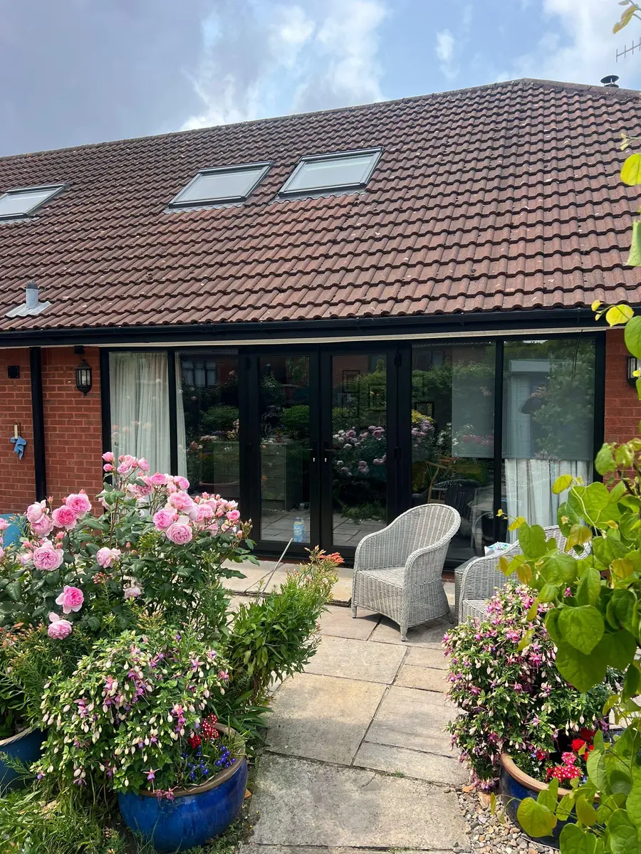 The new black French doors seen from the garden