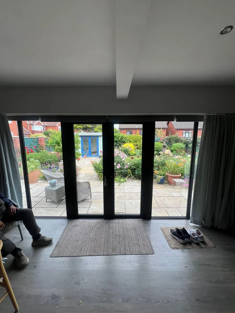 Looking out through the new black French doors from inside