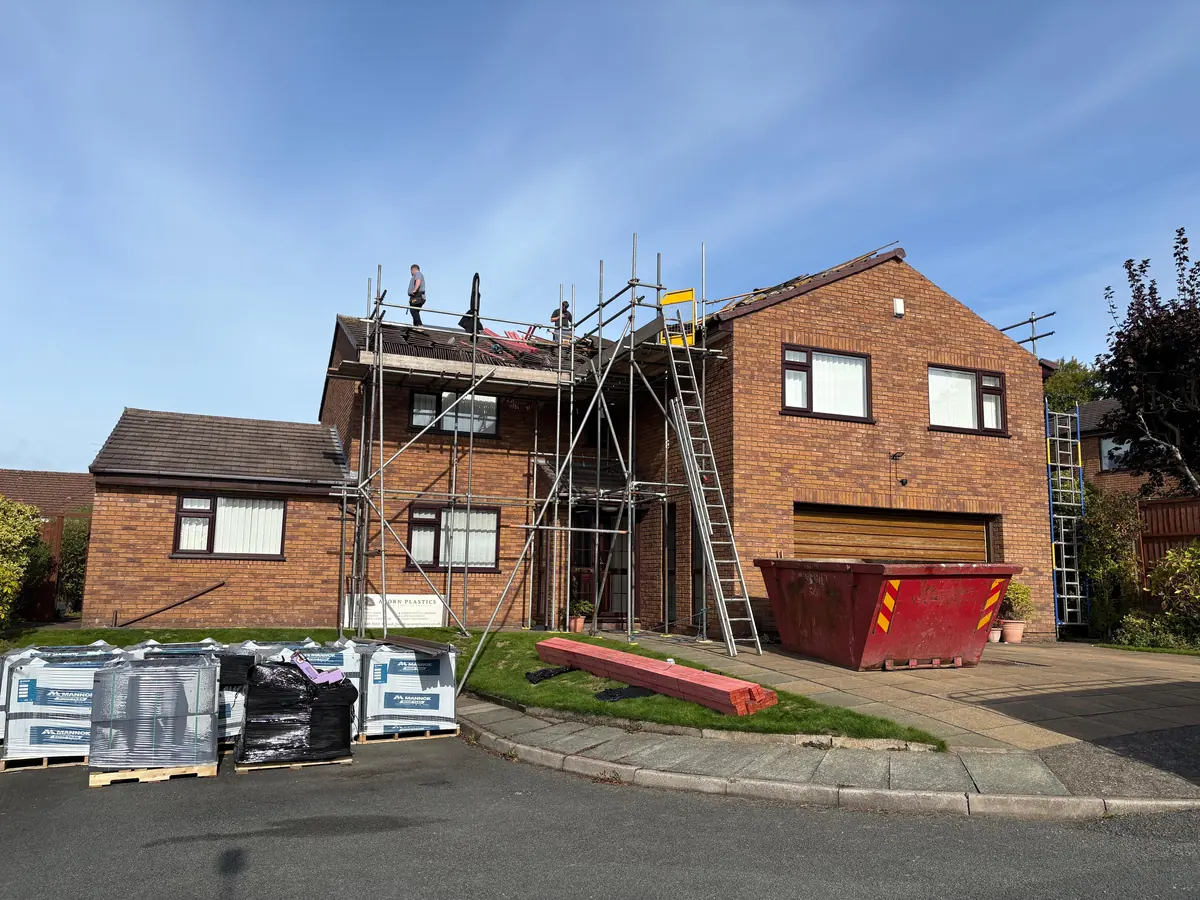The skip and new roofing materials on site