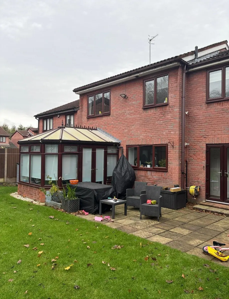 The old conservatory on the rear of the house before the work