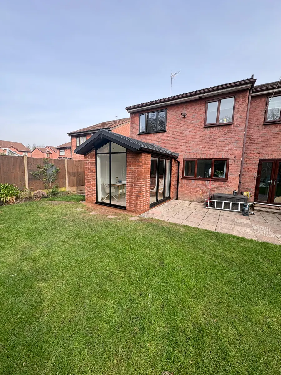The finished brick garden room seen from the lawn