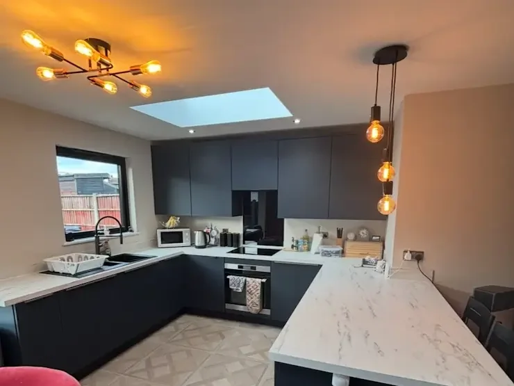 A kitchen with feature and under-cabinet lighting