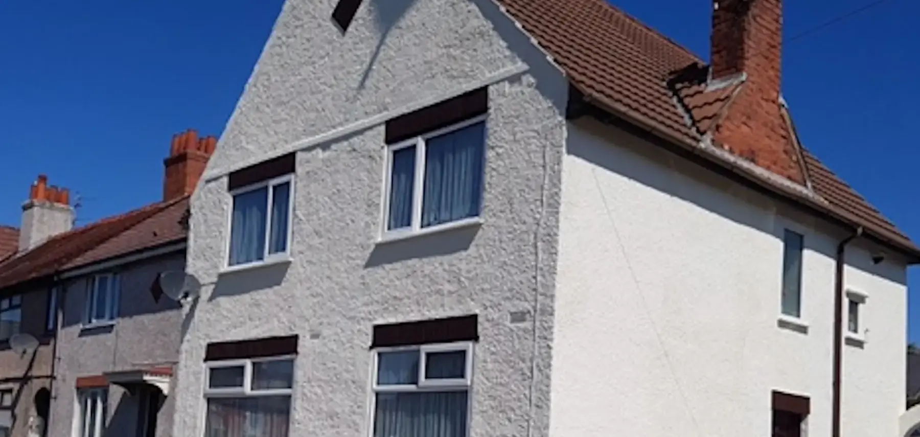 A rendered wall treated with a ProPERLA coating