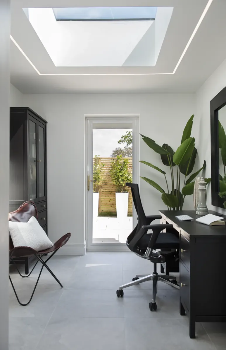 A study with a full-height window and door to the garden