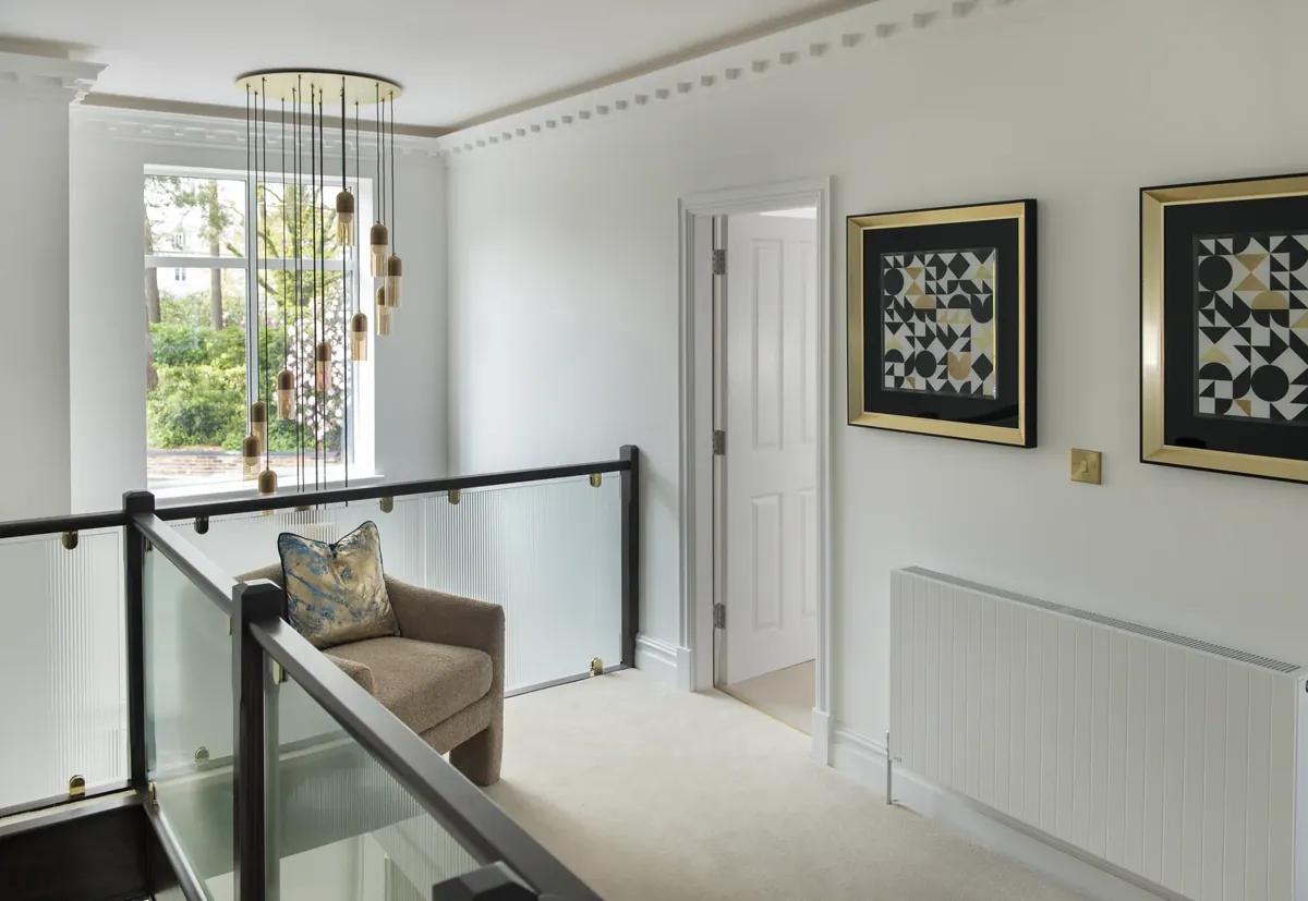 A landing with a window over the stairs