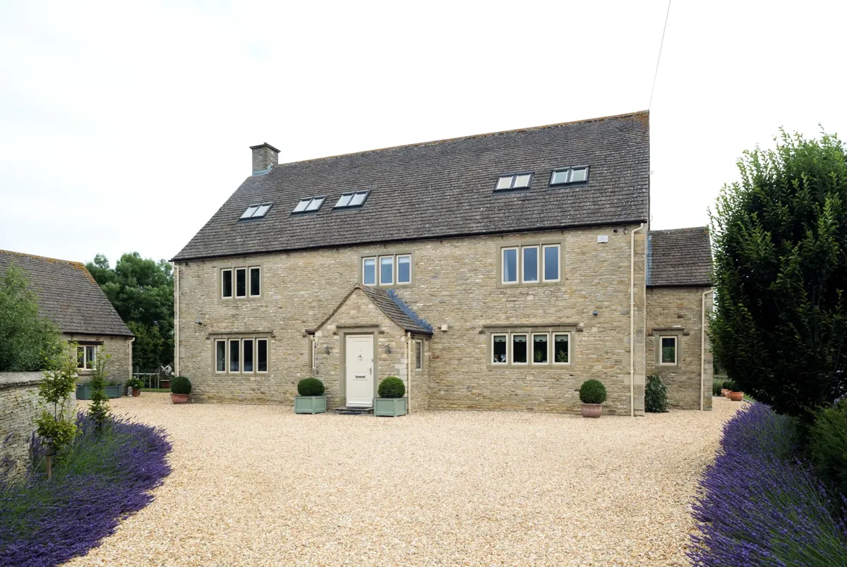 A stone barn conversion with grey windows