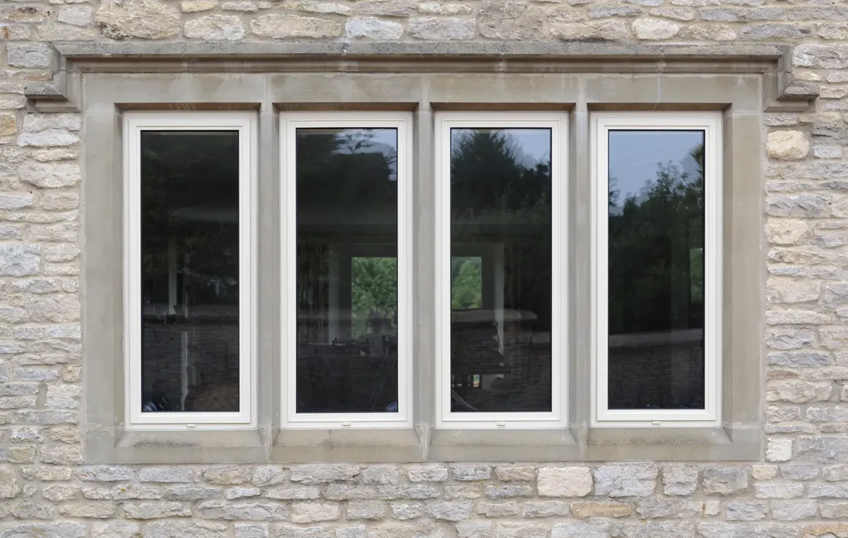 A four-light window in a stone mullion surround
